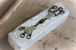 Nine Daughters  |  Triton. Triple Necklace Keeper.