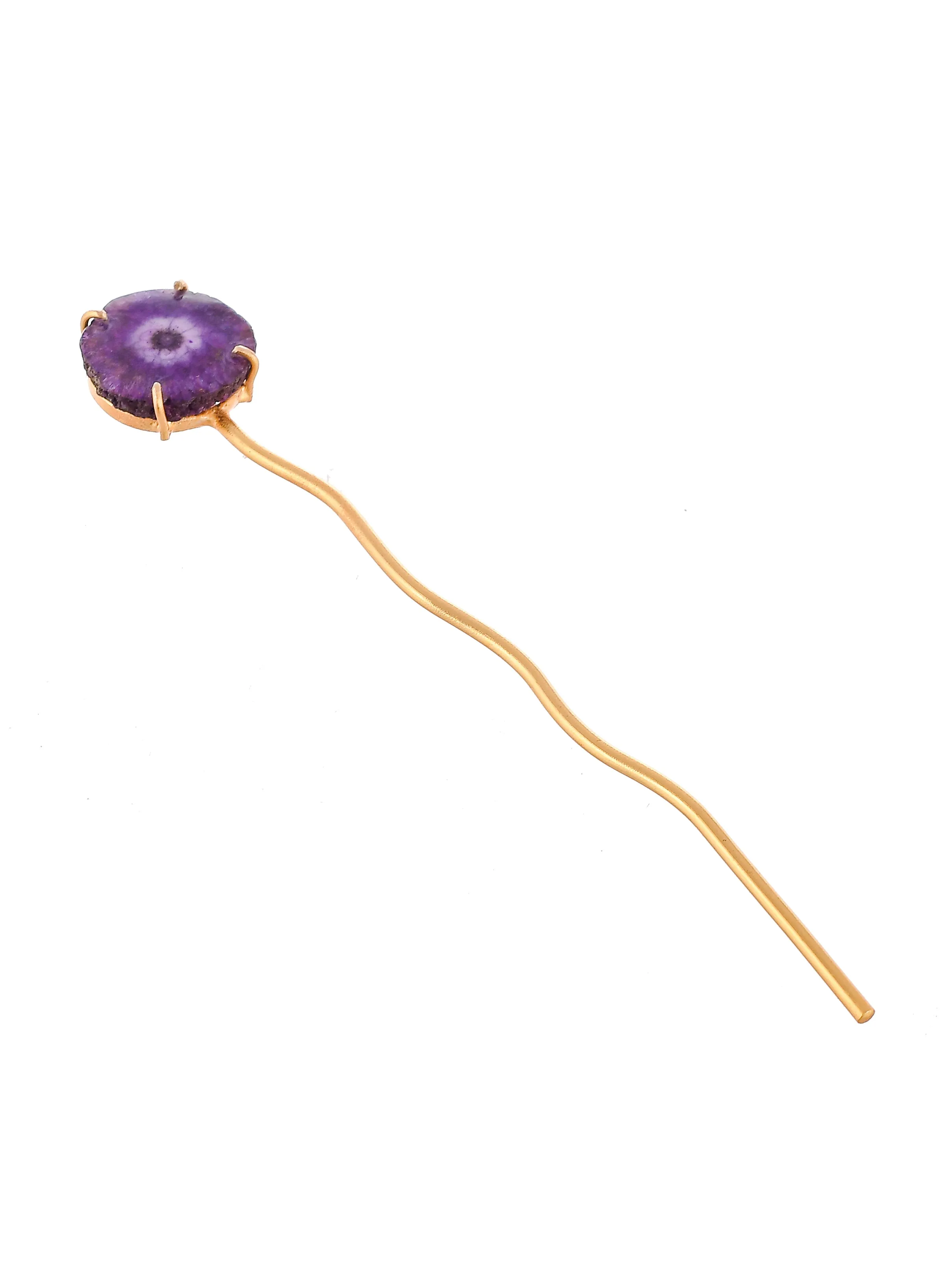 Women gold toned hairstick.