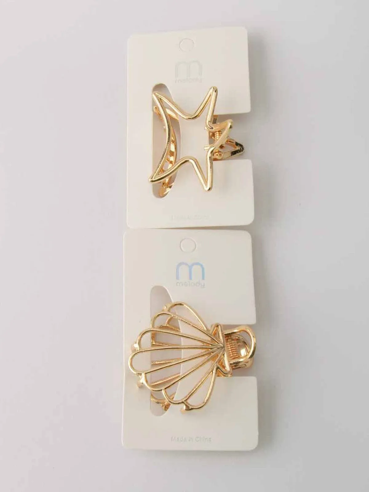 WOMEN'S GOLD SHELLS & STARS CLAW CLIPS